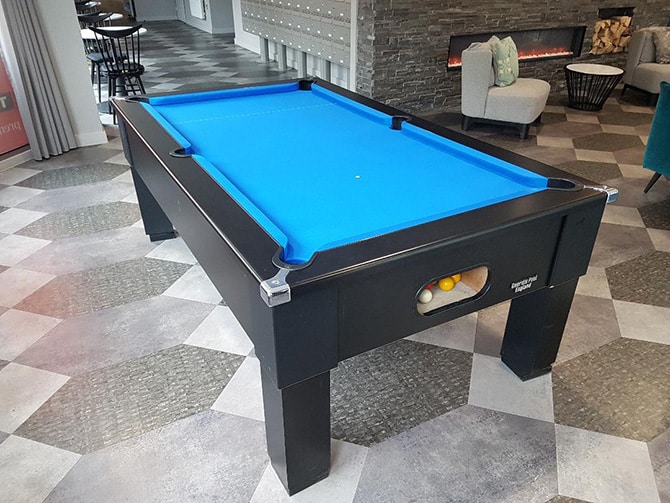 Pool table fitting blue speed cloth. 