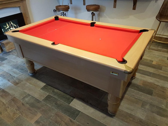 Pool table recover in an orange baize